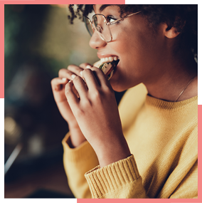 Woman eating sandwich