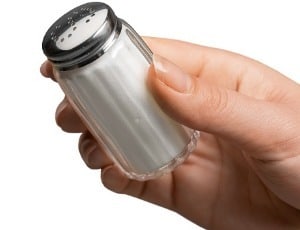 right hand holding salt shaker