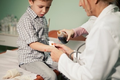 cute-boy-at-doctors-office-iodine-to-cut