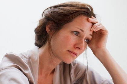 depressed-woman-with-head-in-hands-facing-right