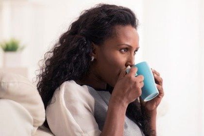 woman-with-morning-blue-mug-of-coffee