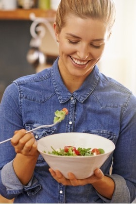 healthy-happy-woman-eating-salad