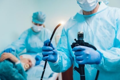 patient-undergoing-endoscopy-at-the-hospital-doctor-holding-endoscope-before-colonoscopy