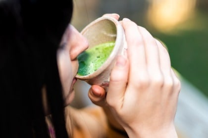 woman-drinking-from-cup-of-matcha-green-tea