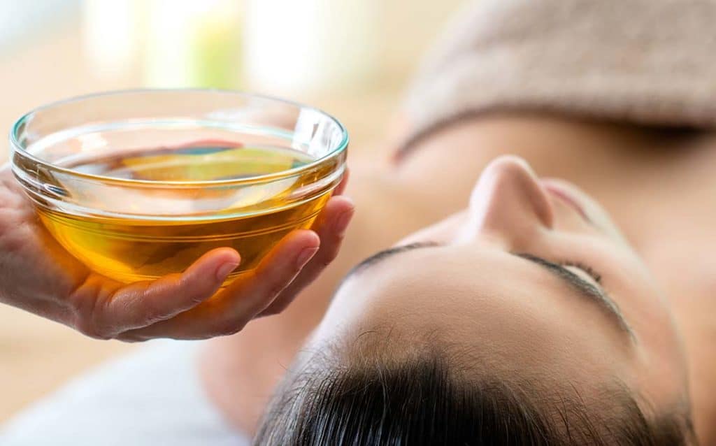 Showing argan oil about to be applied to the face