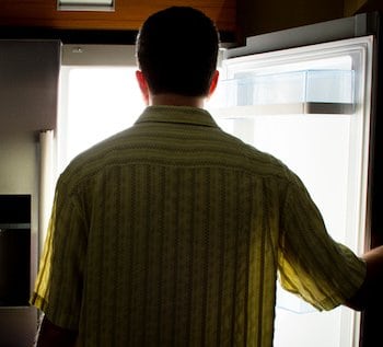 Man opening refrigerator