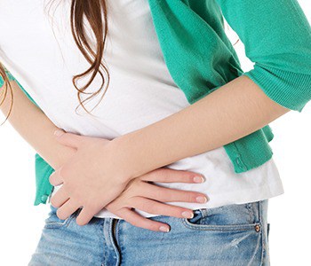 Young woman with upset stomach