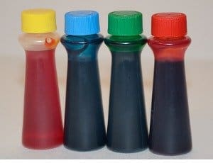 four bottles of food coloring